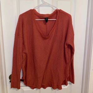 Pink long sleeved v-neck sweater